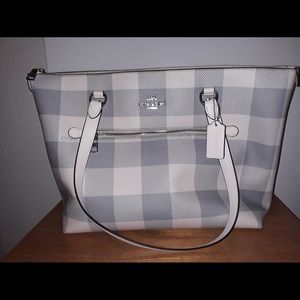 Like New. Coach Tote bag. Color is bluish/gray and white plaid.